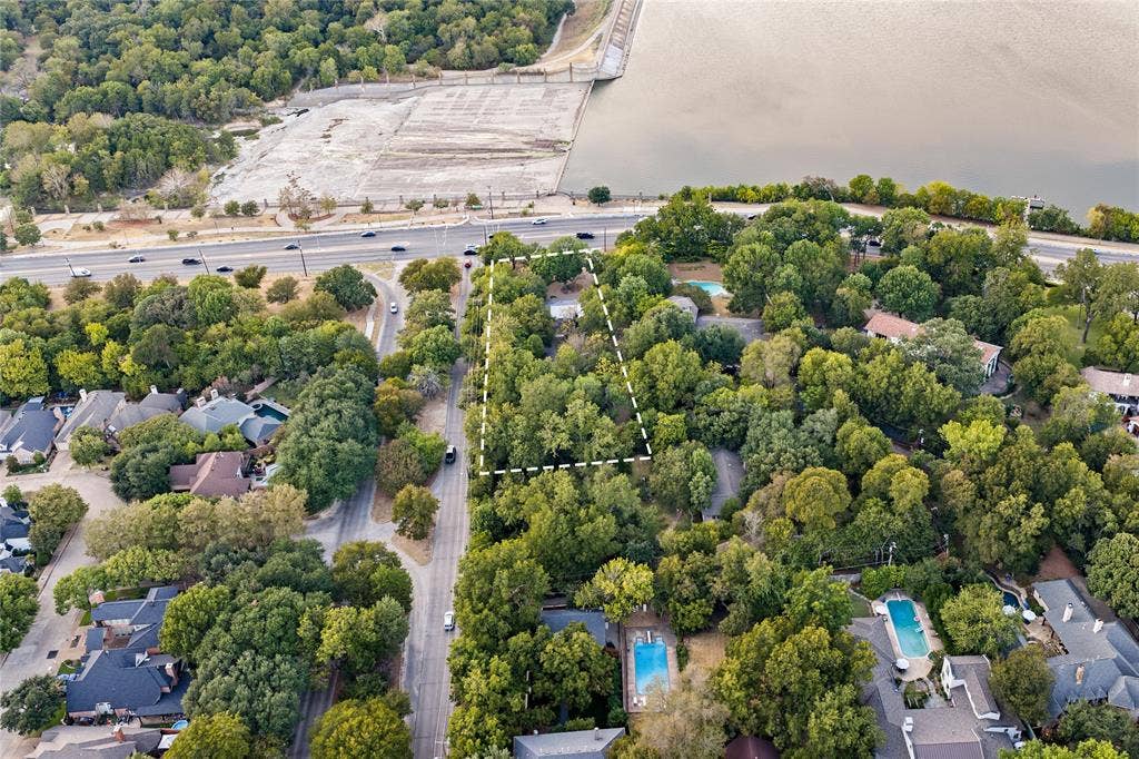 8100 Garland, Dallas, TX 75218 Wooded lot with mature trees, offering a natural setting