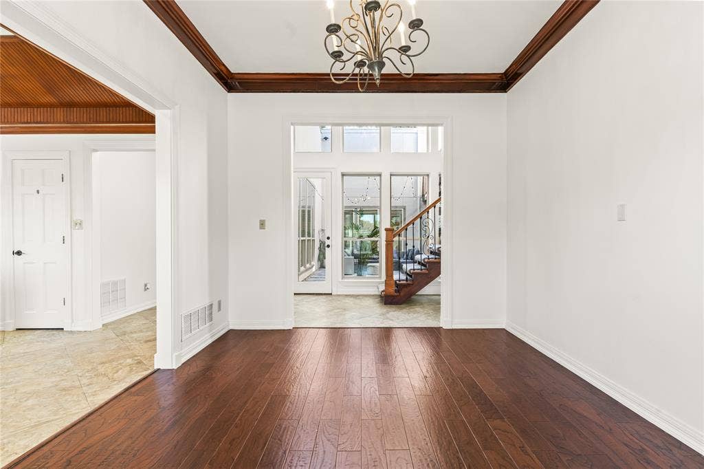 6423 Ridgemont Drive, Dallas, TX 75214 Dark wood-finish flooring with white baseboards