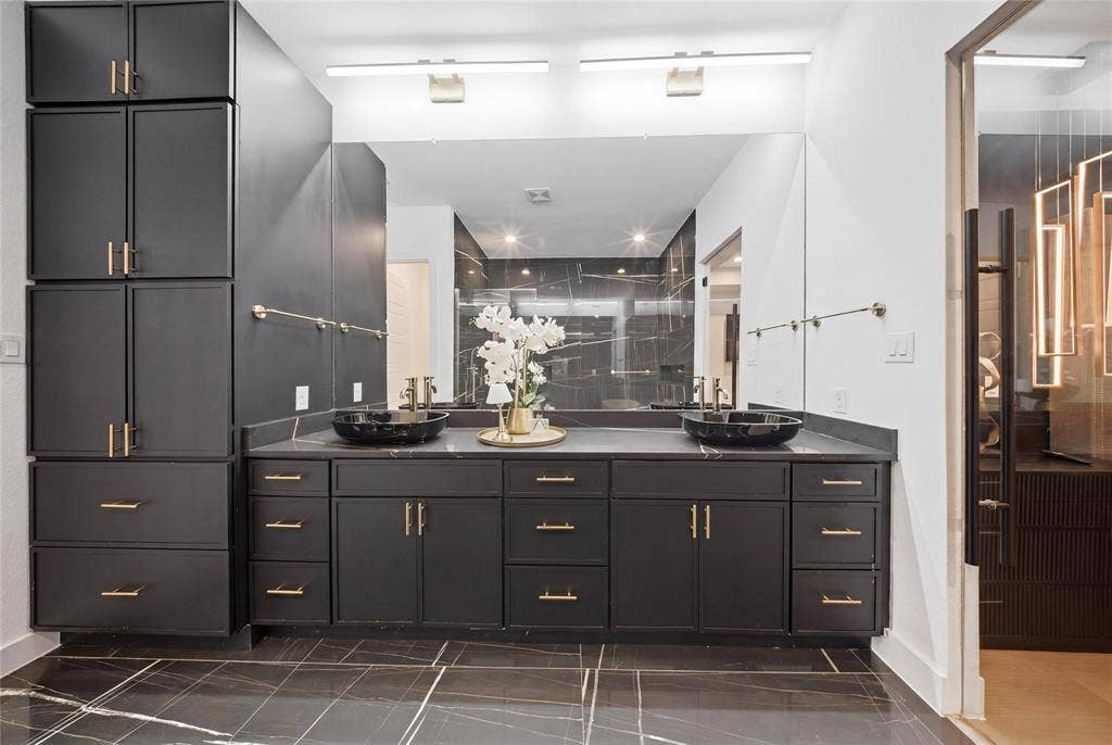 522 S Clark Road, Cedar Hill, TX 75104 Dual vessel sinks, expansive vanity with extensive cabinetry, full-width mirror, and marble-look floor tiling
