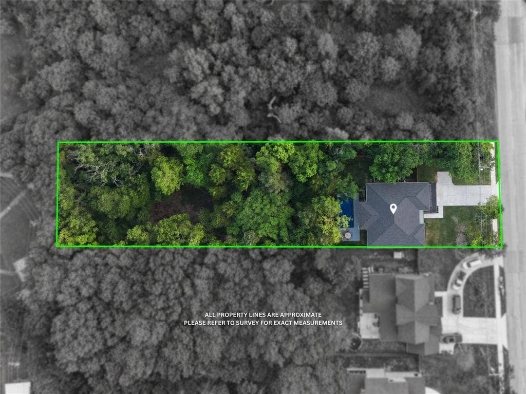 522 S Clark Road, Cedar Hill, TX 75104 Property featuring a dark-toned roof, an inground pool, and a paved driveway