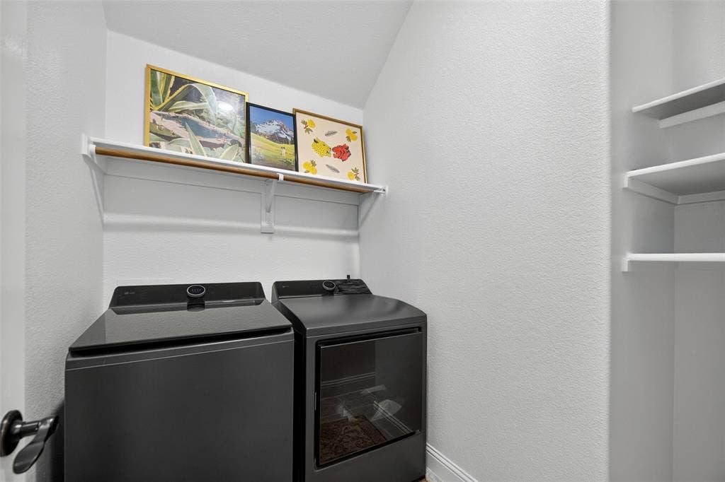 3210 Creekhaven Drive, Melissa, TX 75454 Laundry area featuring white built-in shelving and integrated hanging rods