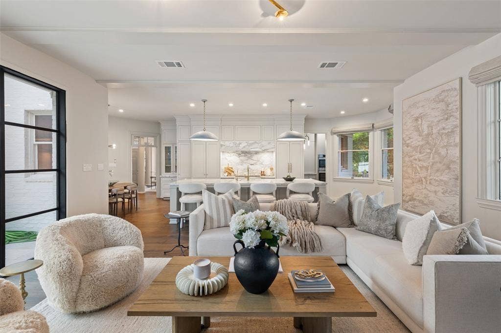 4201 Green Cliffs Road, Austin, TX 78746 Open-concept living area with wood-finish flooring, a kitchen island, white cabinetry, and recessed lighting