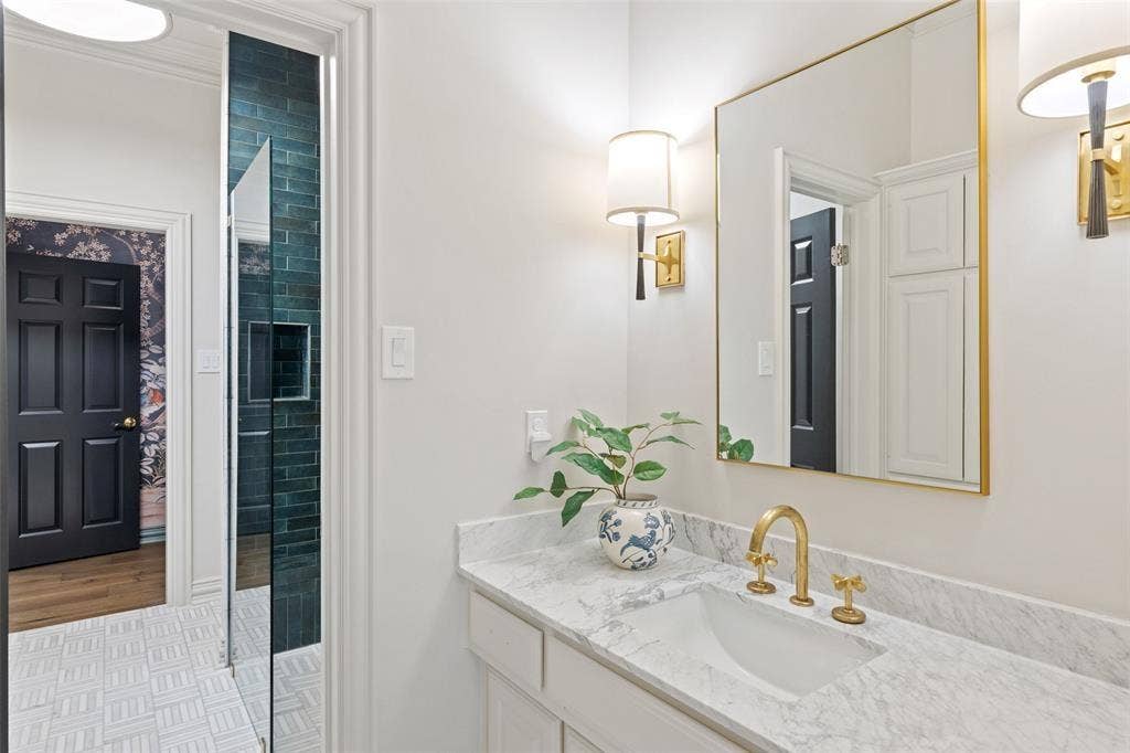 4201 Green Cliffs Road, Austin, TX 78746 White vanity with a stone countertop and an undermount sink