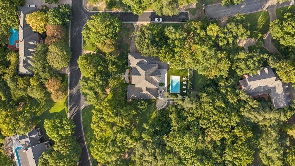 4201 Green Cliffs Road, Austin, TX 78746 Lush green surroundings, private swimming pool, and dedicated outdoor lounging area