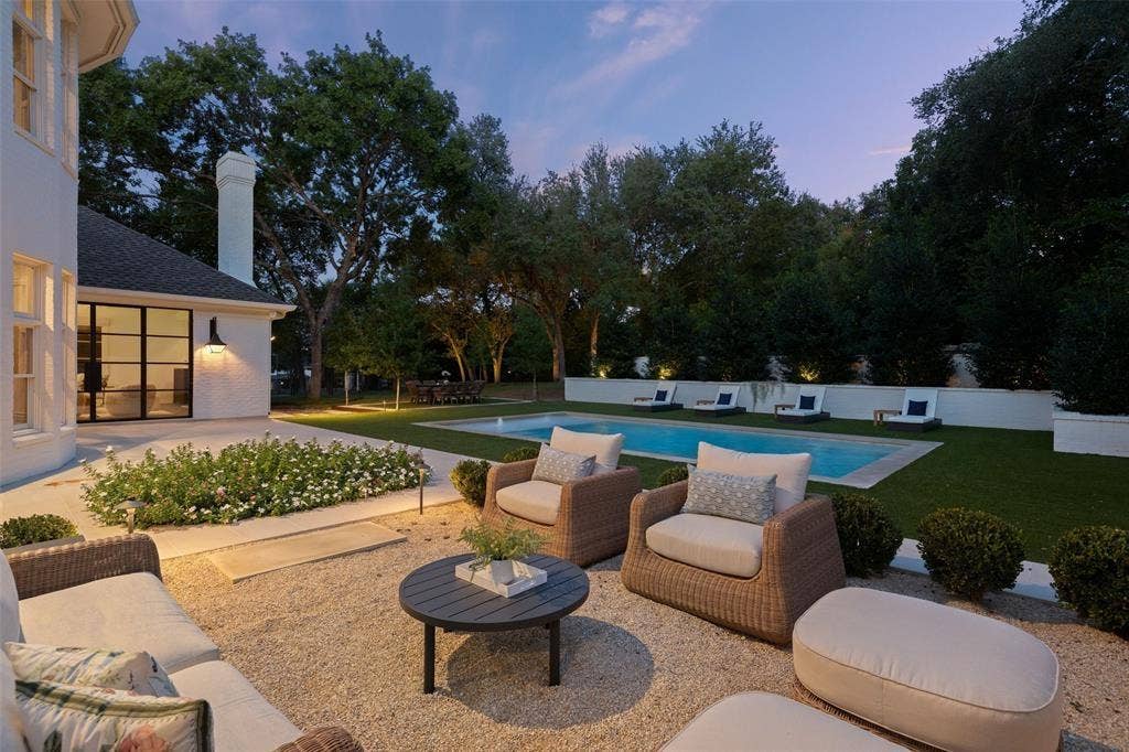 4201 Green Cliffs Road, Austin, TX 78746 Exterior patio with gravel surfacing, an in-ground swimming pool, and manicured landscaping