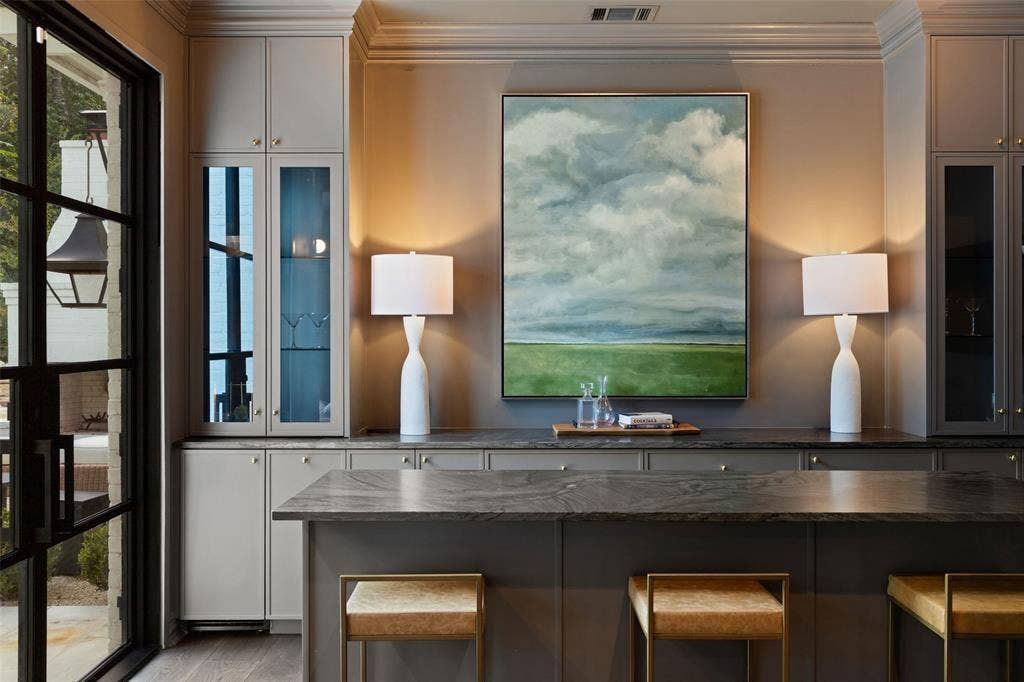 4201 Green Cliffs Road, Austin, TX 78746 Built-in cabinetry with glass-front display, undermount lighting, and stone countertops