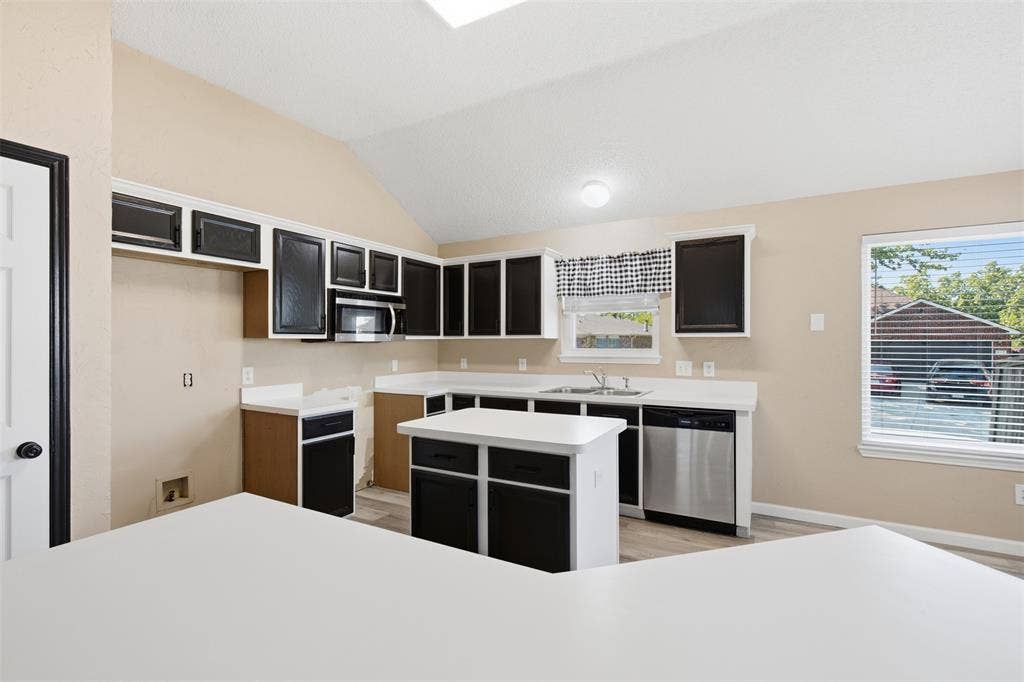 1301 Mill Wood Lane, Garland, TX 75040 LOTS OF CABINETS IN KITCHEN