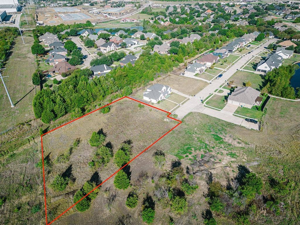 210 Caprock, Sunnyvale, TX 75182 Expansive undeveloped land parcel featuring varied terrain and mature trees