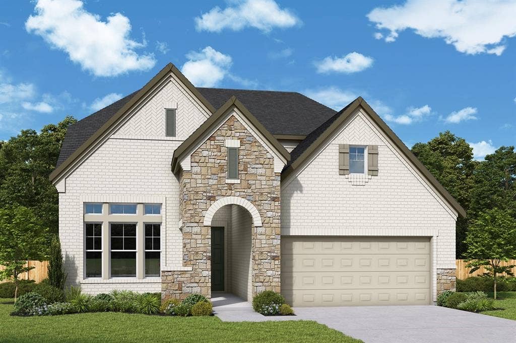 White brick exterior with stone accents and an arched entryway