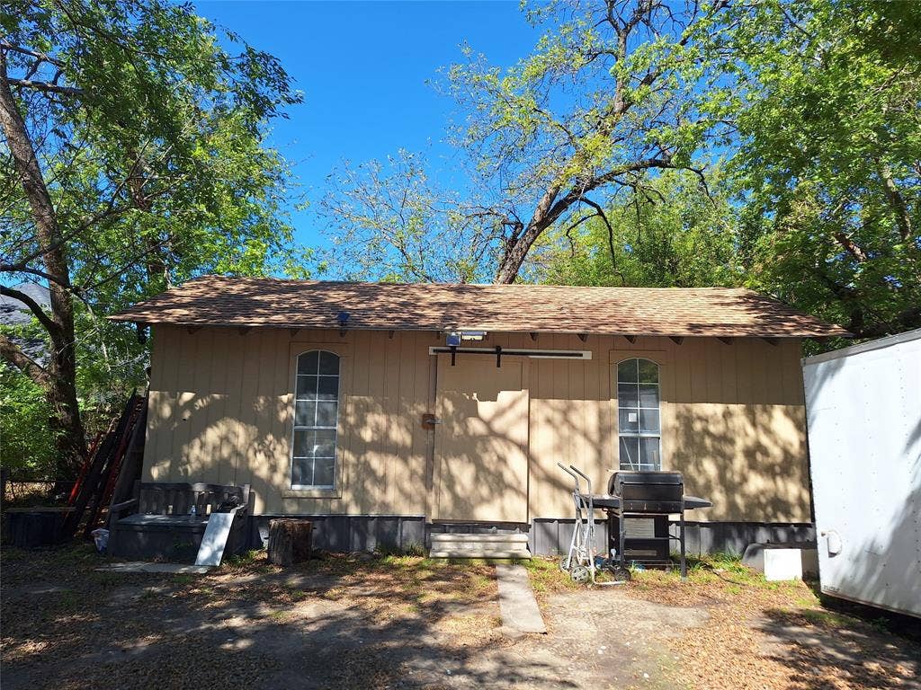 1514 Oneal Street, Greenville, TX 75401 Utility building with arched windows and a shingle roof