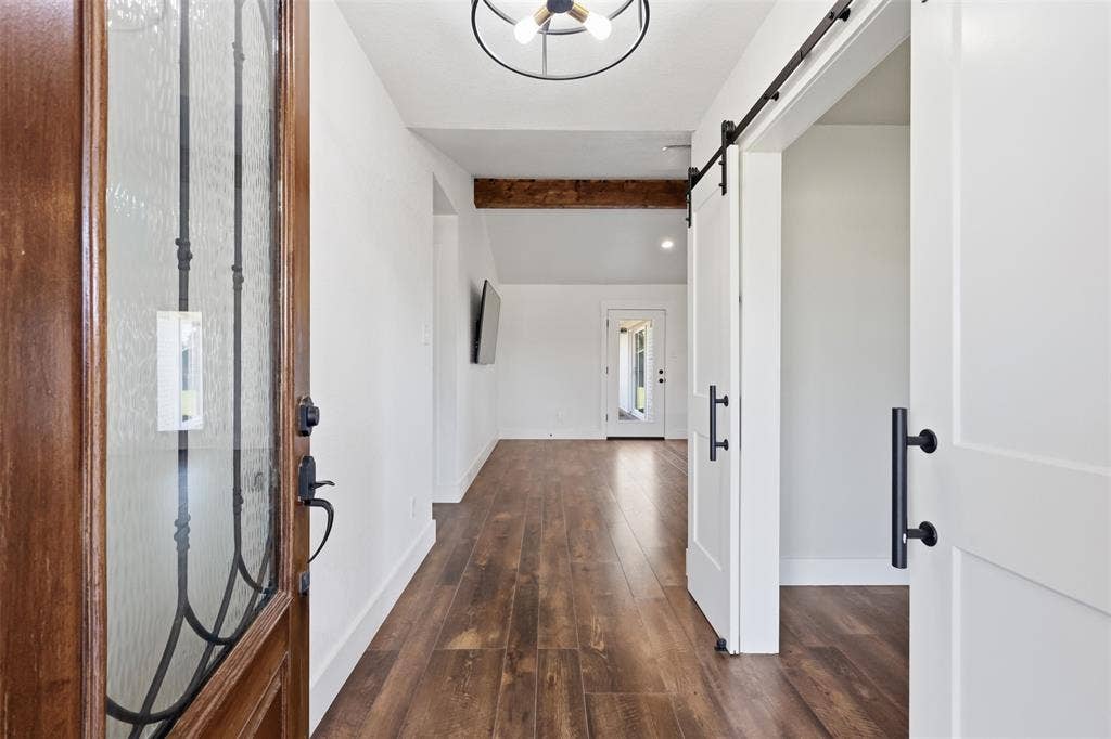 Front entrance with office or flex space on the right and living room straight ahead