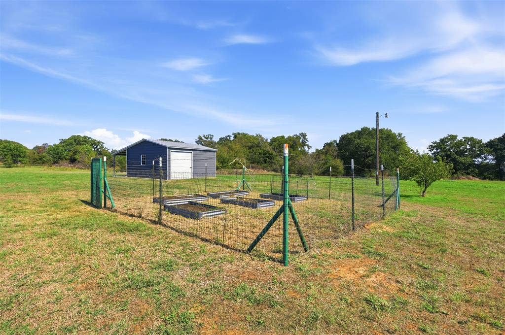 enclosed gardening area for fresh veggies and herbs