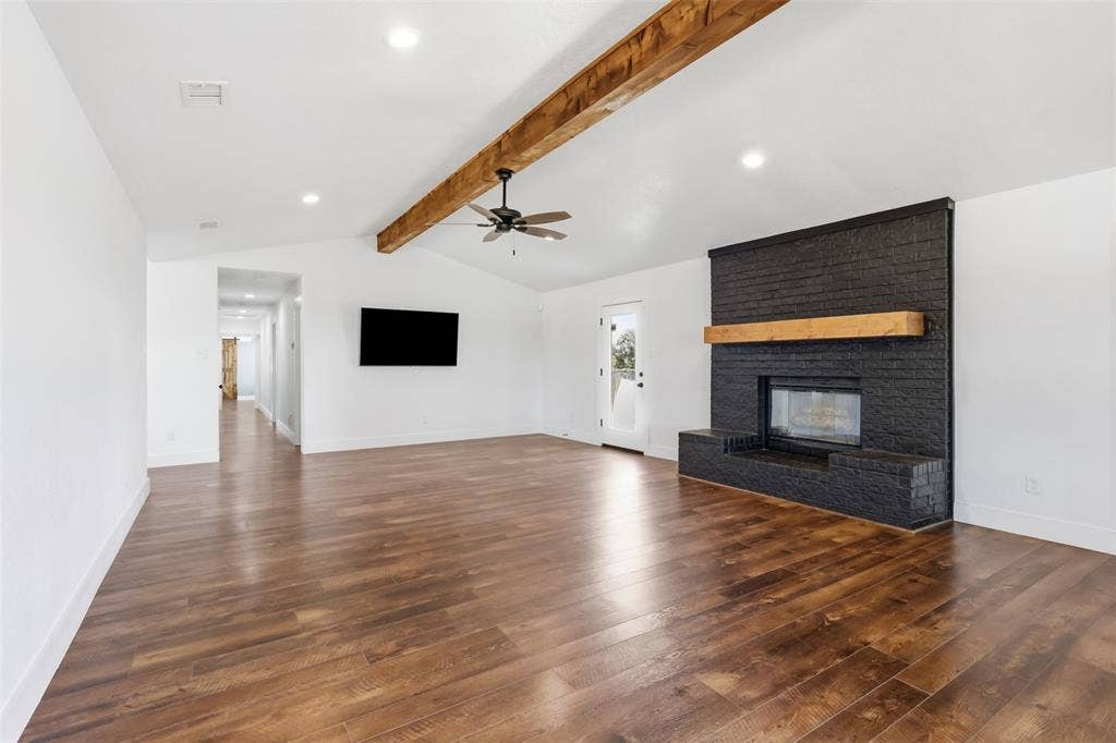 Living room with brick fireplace