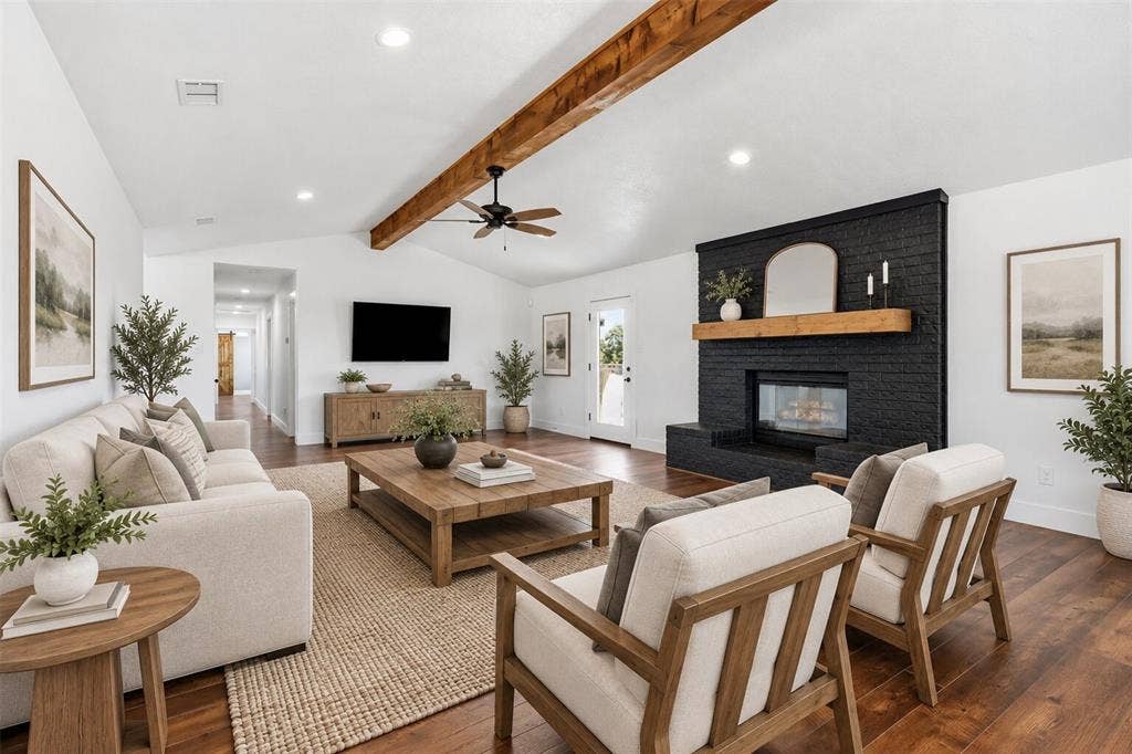 virtually staged living room with dining space behind chairs