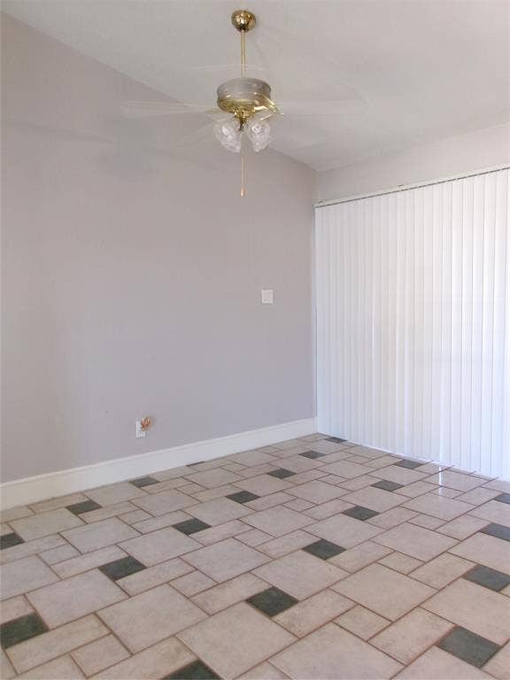 665 Stonewall Drive, Grand Prairie, TX 75052 Patterned tile flooring, ceiling fan with integrated lighting, and vertical window blinds