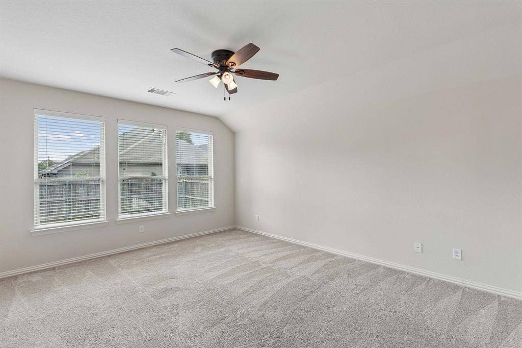 1906 Faircrest Lane, Wylie, TX 75098 The primary bedroom is at the back of the home giving additional privacy. The spacious room offers ceiling fan and carpet.