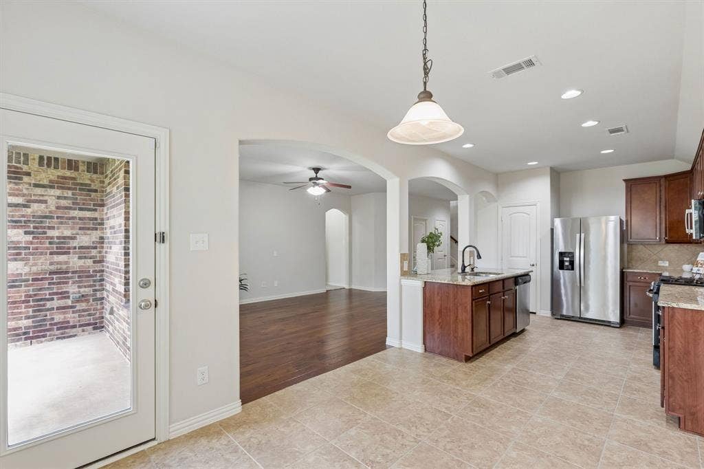 1906 Faircrest Lane, Wylie, TX 75098 This view from the casual dining space shows the open flow of the first floor.
