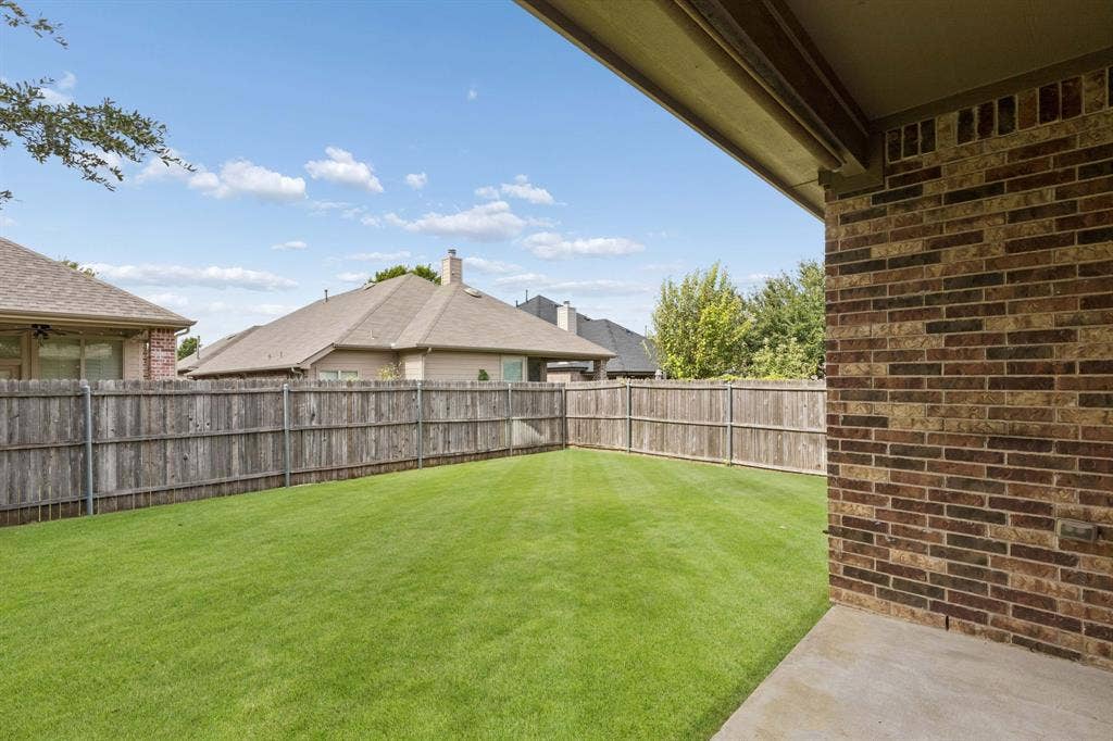 1906 Faircrest Lane, Wylie, TX 75098 Grassy, fenced backyard is perfect for kids and pets. The covered patio gives space for enjoying the outdoors.
