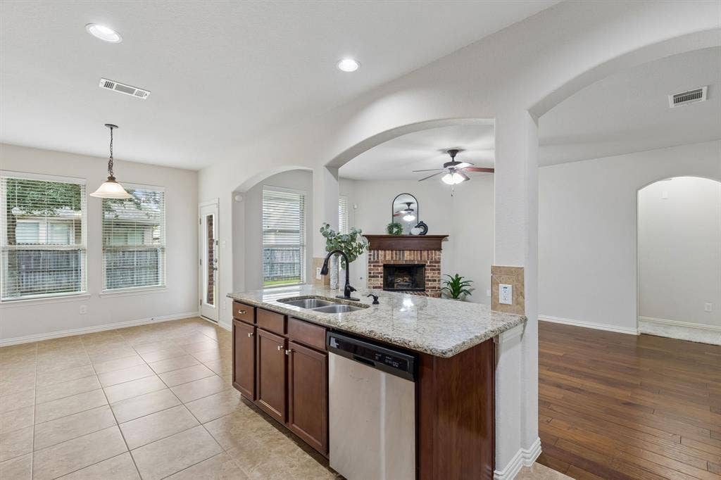 1906 Faircrest Lane, Wylie, TX 75098 Stay part of the action as you work in the kitchen. The large island with sink offers a nice area to work or to serve from when entertaining.