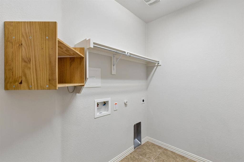 1906 Faircrest Lane, Wylie, TX 75098 The utility room is conveniently located with easy access to the primary and secondary bedrooms.