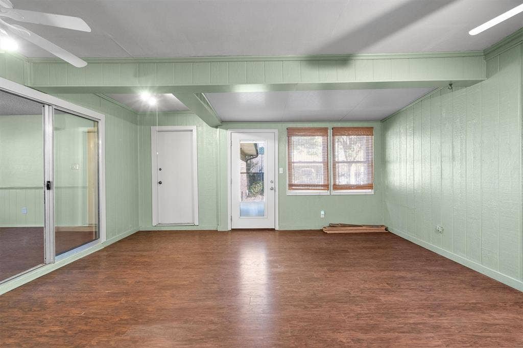 1305 Stonewood Drive, Carrollton, TX 75006 Versatile enclosed patio with seamless access to the yard and garage