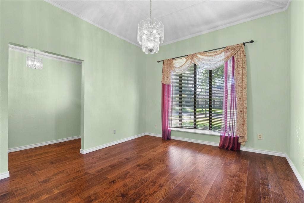 1305 Stonewood Drive, Carrollton, TX 75006 Bright dining area featuring a bay window with front views