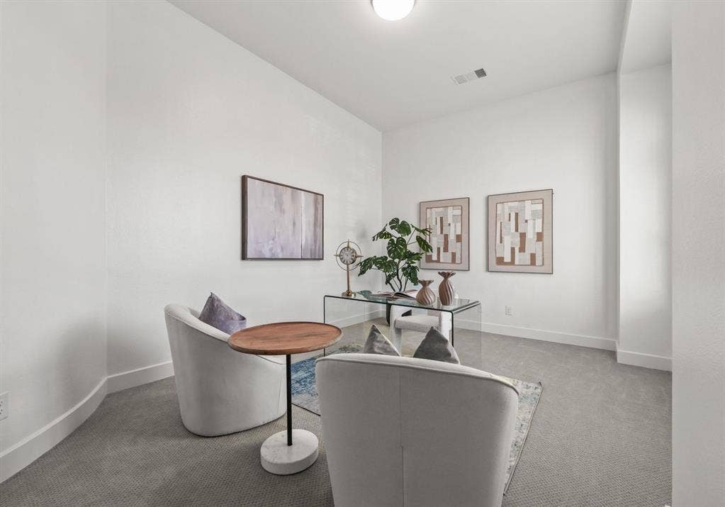 2628 Camden Court, Celina, TX 75009 Interior room featuring high ceilings, neutral wall tones, and neutral-toned wall-to-wall carpeting