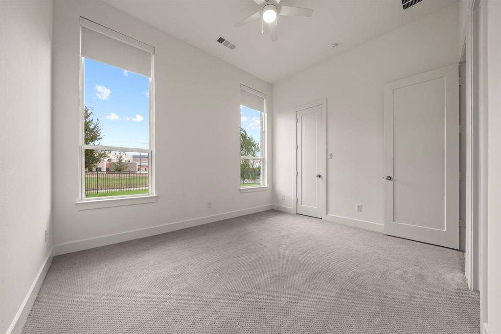2628 Camden Court, Celina, TX 75009 High ceilings, neutral carpeting, dual large windows, and a ceiling fan with integrated lighting