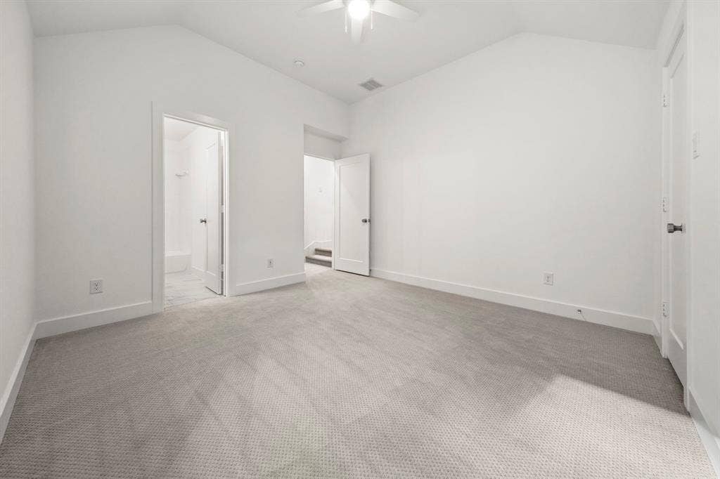 2628 Camden Court, Celina, TX 75009 Vaulted ceiling featuring a central ceiling fan, neutral wall-to-wall carpeting, and solid-core interior doors