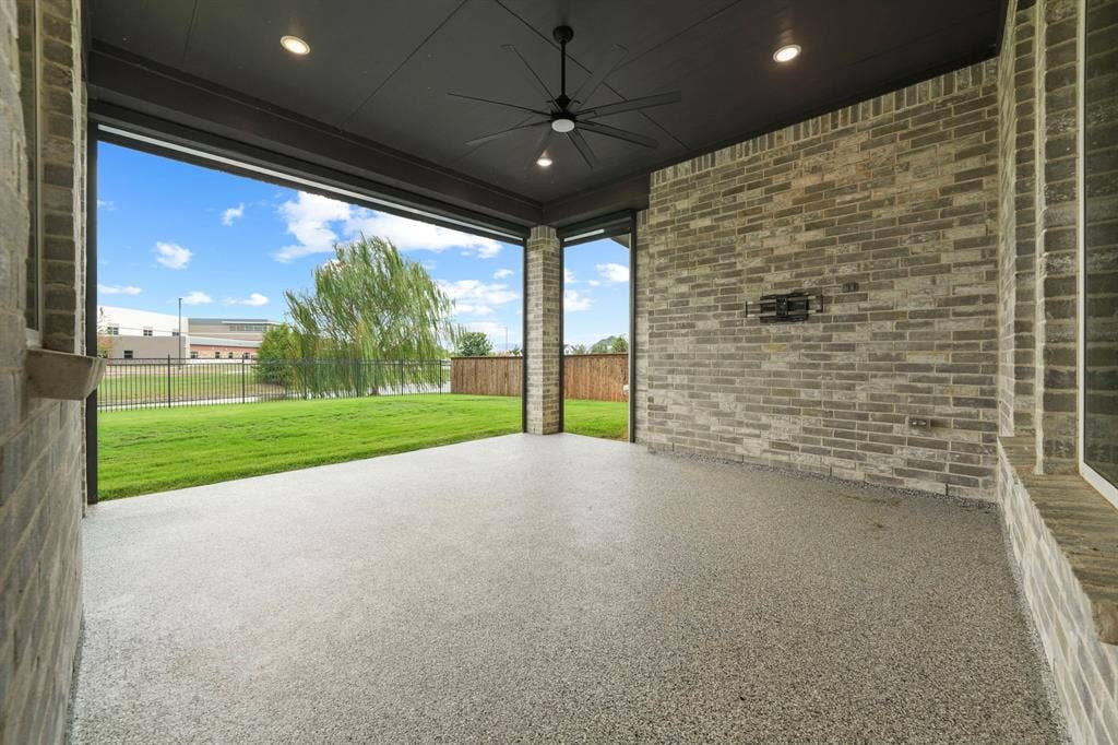 2628 Camden Court, Celina, TX 75009 Covered patio featuring an exposed brick wall, recessed lighting, ceiling fan, and finished concrete flooring