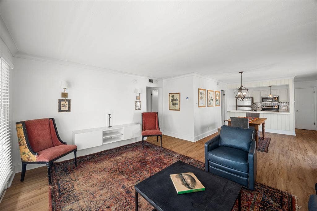 5907 E University Boulevard, #201, Dallas, TX 75206 Living room with double doors out to balcony