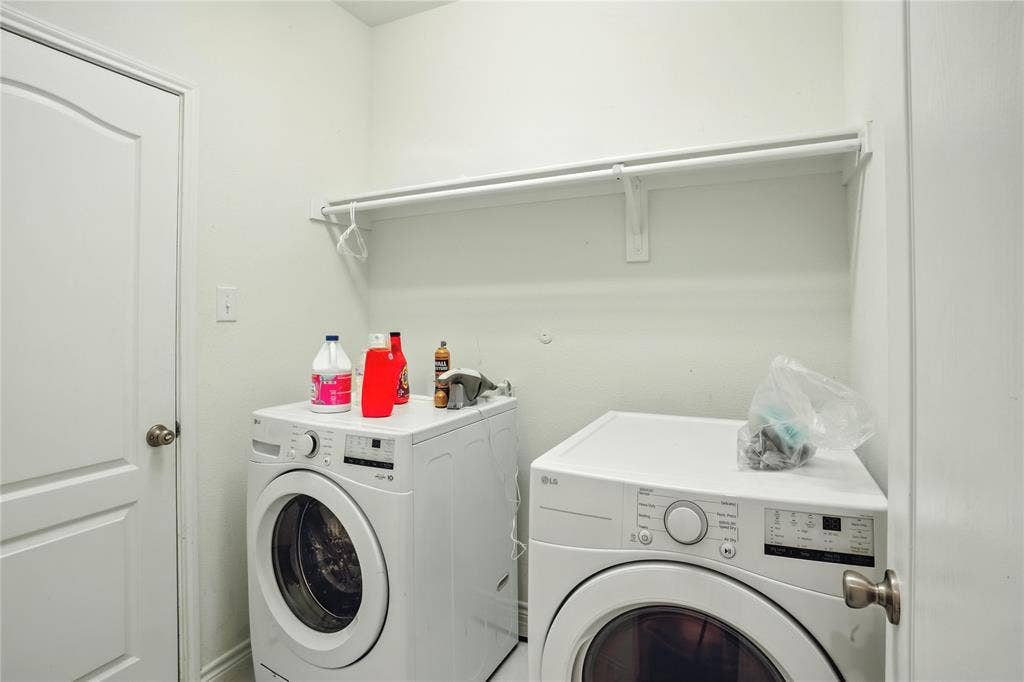 Washroom featuring independent washer and dryer