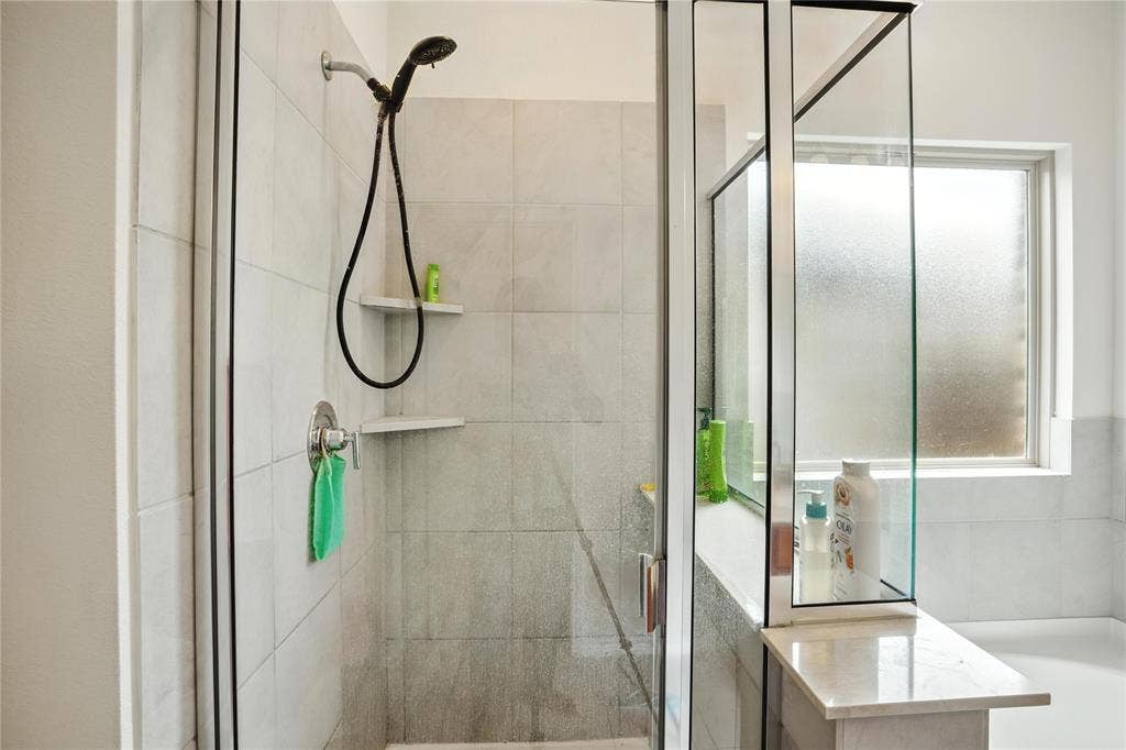 Full bath with a shower stall