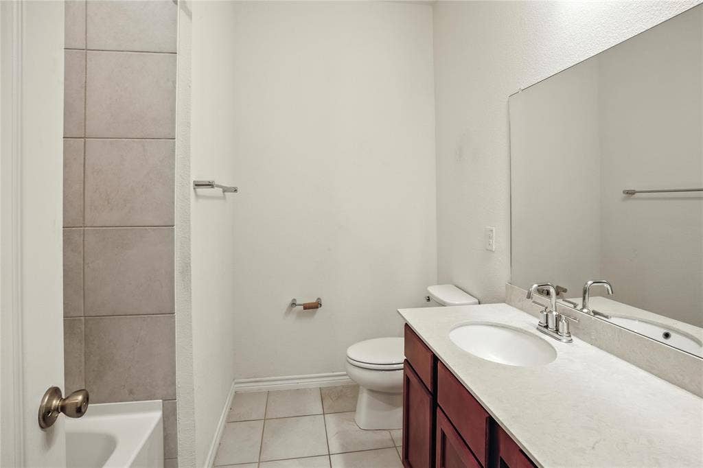 Bathroom featuring vanity and tile patterned flooring