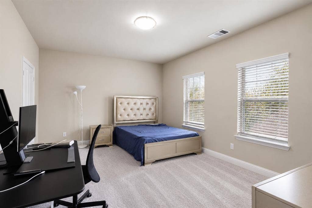 1603 Coventry Court, Farmers Branch, TX 75234 Neutral-toned walls complement the light-colored carpeting