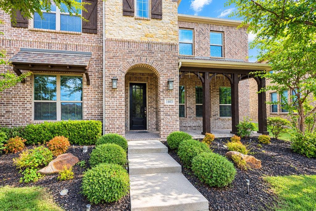 1603 Coventry Court, Farmers Branch, TX 75234 Brick and stone exterior with arched entry