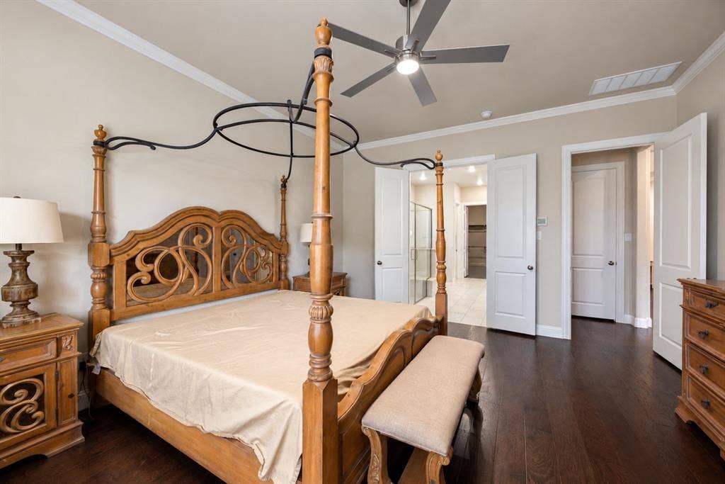 1603 Coventry Court, Farmers Branch, TX 75234 Dark wood-finish flooring, crown molding, and a ceiling fan with integrated lighting
