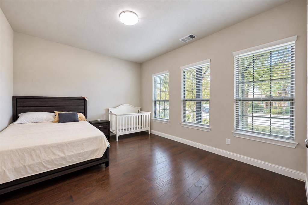 1603 Coventry Court, Farmers Branch, TX 75234 Rich wood-finish flooring complements neutral wall tones