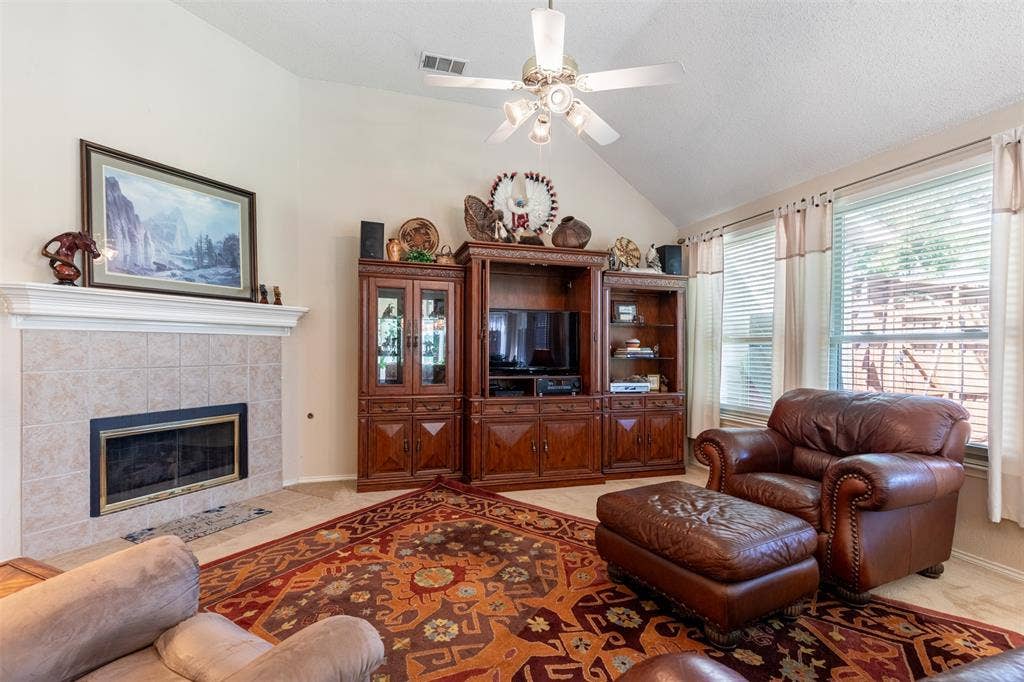 10208 Noel Drive, Frisco, TX 75035 Living room with fireplace.