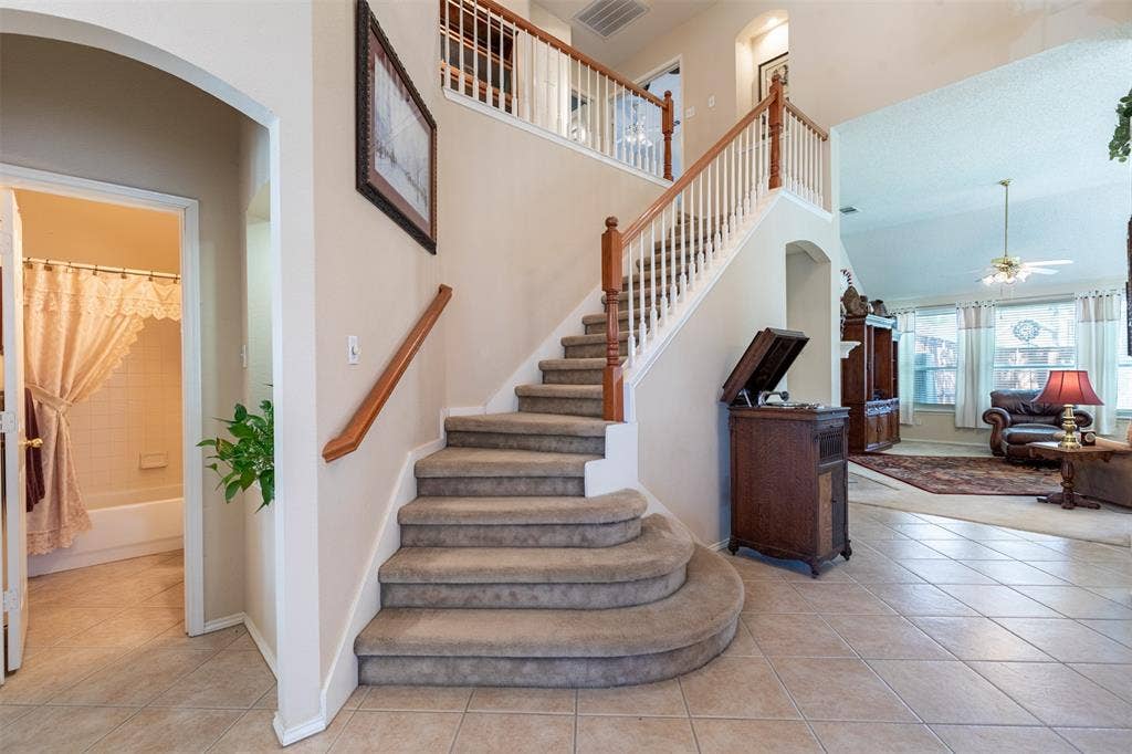 10208 Noel Drive, Frisco, TX 75035 Staircase with balcony.