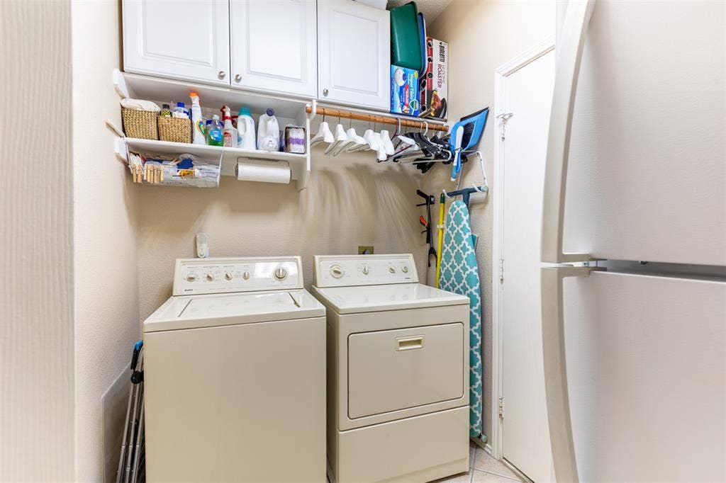 10208 Noel Drive, Frisco, TX 75035 Laundry room with cabinetry.