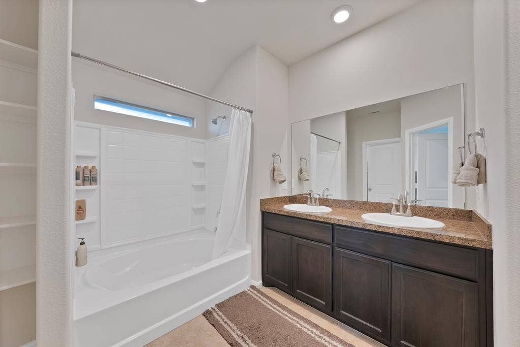 228 Foxhunter Street, Fort Worth, TX 76131 Double vanity with a composite countertop and integrated sinks