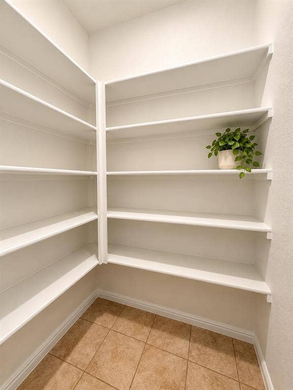 228 Foxhunter Street, Fort Worth, TX 76131 Built-in shelving, extensive storage, ceramic tile flooring, neutral wall tones