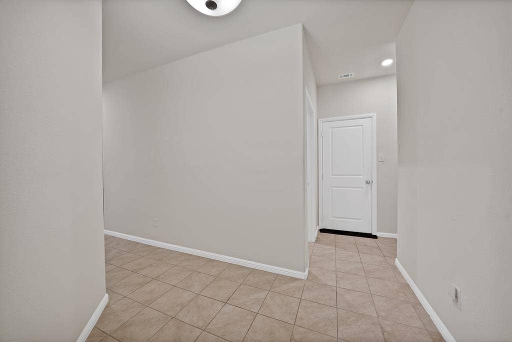 228 Foxhunter Street, Fort Worth, TX 76131 Tile flooring with light-toned walls and recessed lighting