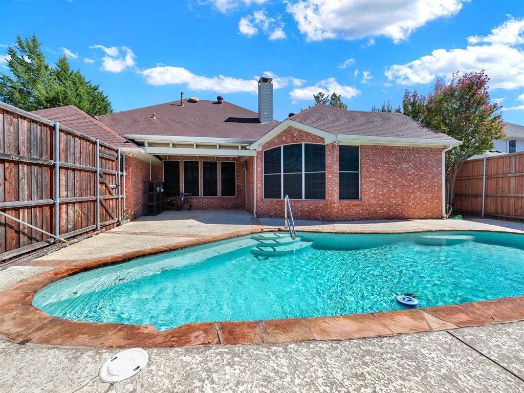 A sparkling backyard pool pairs with a shaded covered patio, giving you space to enjoy both sunshine and a cool retreat. Slip into the water after work, then linger over an easy outdoor supper as the day winds down.