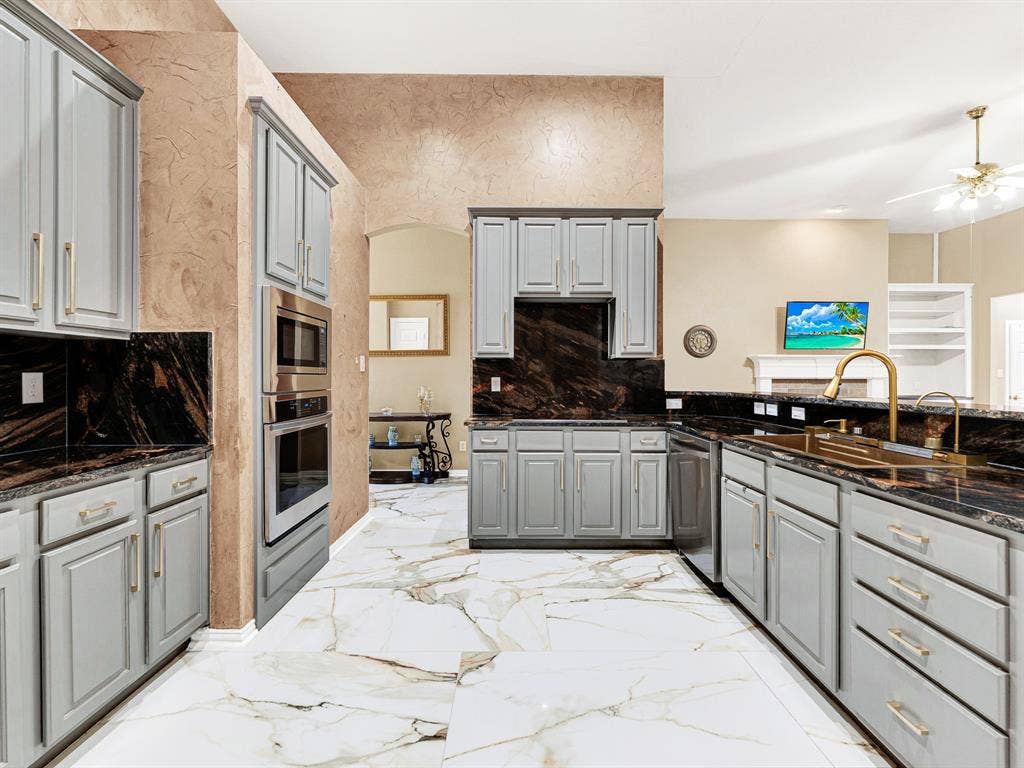 An induction cooktop and all kitchen appliances updated in 2026 complement generous counters with room to prep and serve. Try a new recipe while someone nearby sneaks a taste before dinner.
