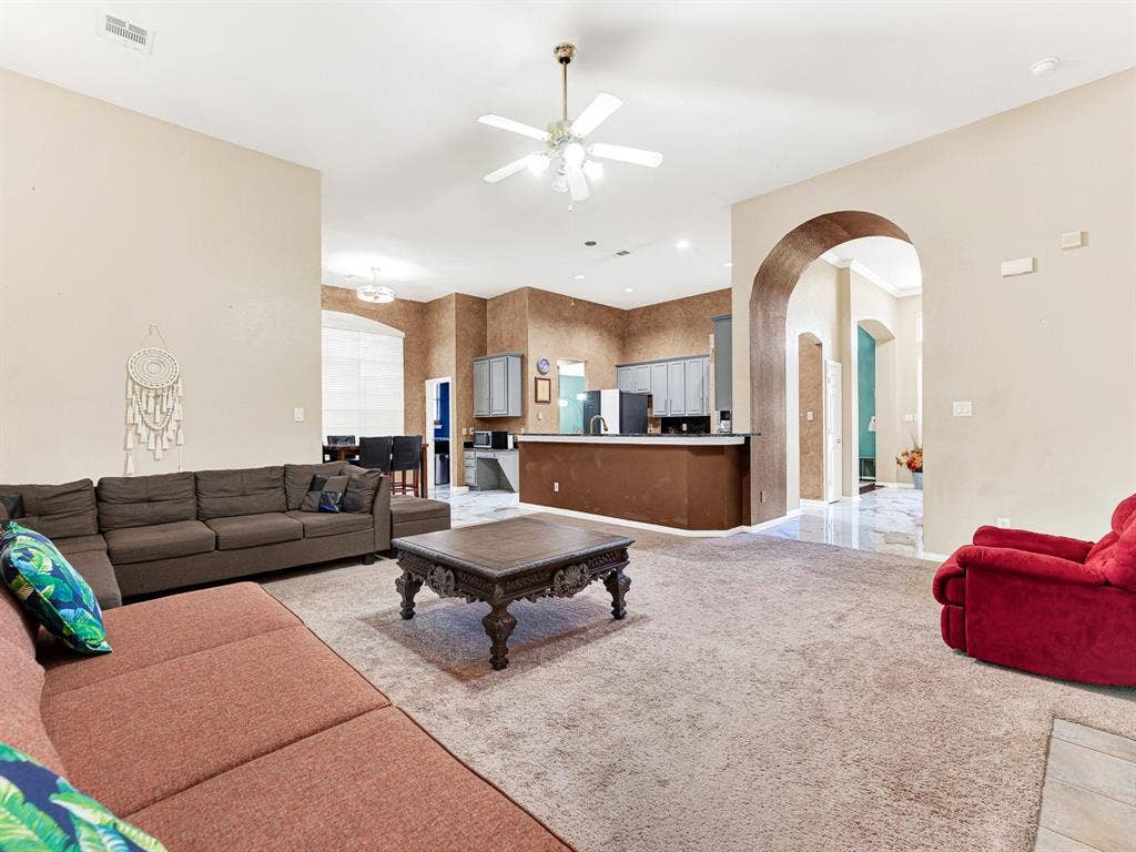 The family room opens directly to the kitchen and breakfast area, giving everyone room to spread out while staying connected. Keep a movie night going with easy trips for popcorn and a second round of snacks.