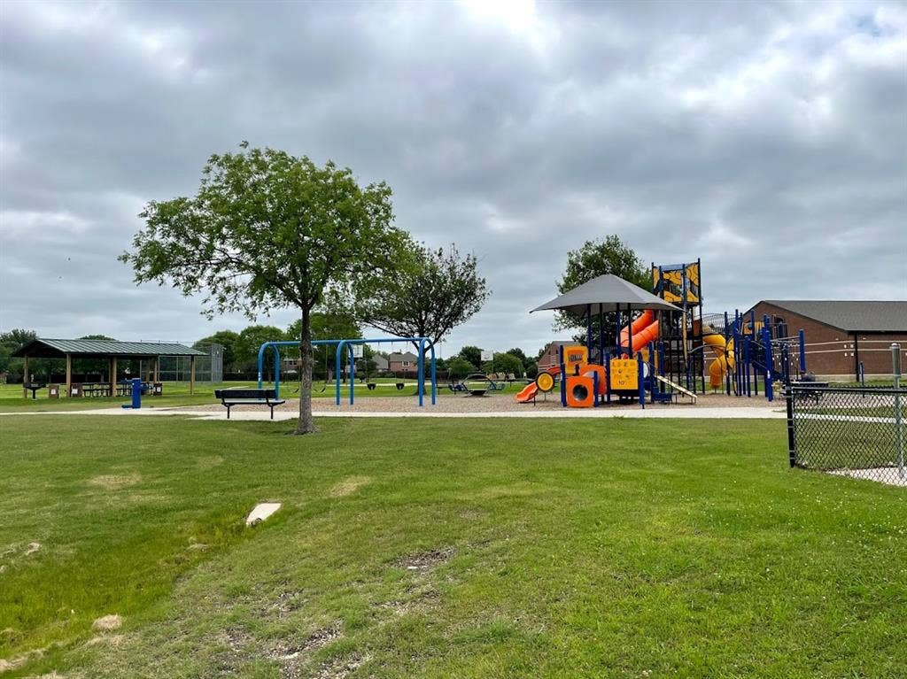 The park near Miller Elementary is within walking distance, offering a playground, open lawn, and a covered picnic pavilion close to home. Walk over after school for playtime and a snack before heading home together.