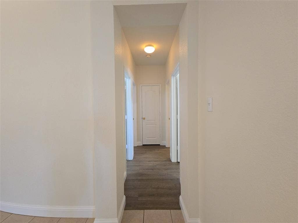 1545 Crystal Pass, Allen, TX 75002 Hallway with wood-finish flooring, light-colored walls, and a ceiling-mounted light fixture