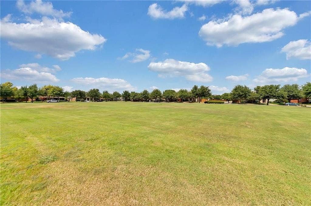 1545 Crystal Pass, Allen, TX 75002 Expansive green space featuring a large grassy area and mature trees